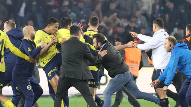 A photo taken after Fenerbahce won 3-2 at Trabzonspor in March 2024 and hundreds of home fans stormed the field